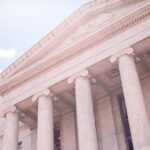 Government Incentives - white concrete building under sky