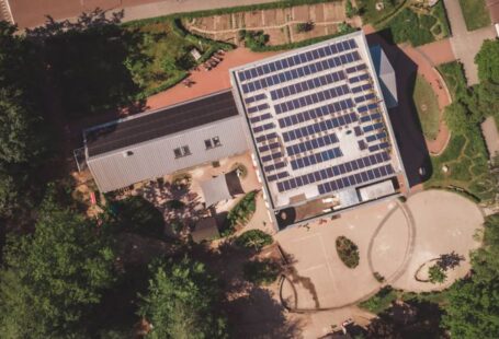 School Solar - an aerial view of a building with solar panels on the roof