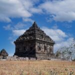 Yogyakarta Heritage - a large stone structure in the middle of a field