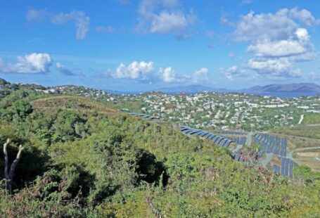 Community Solar - a scenic view of a city from a hill