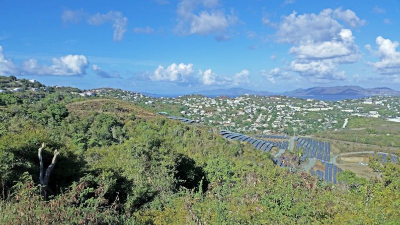 Community Solar - a scenic view of a city from a hill