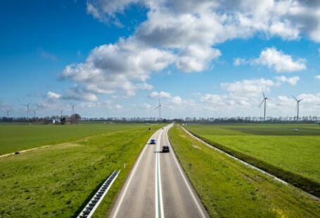 Solar Transport - green grass field under blue sky during daytime