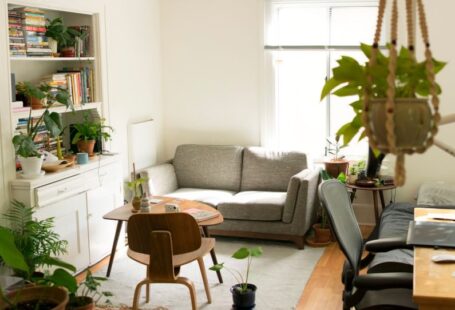 Design Solar - gray fabric loveseat near brown wooden table