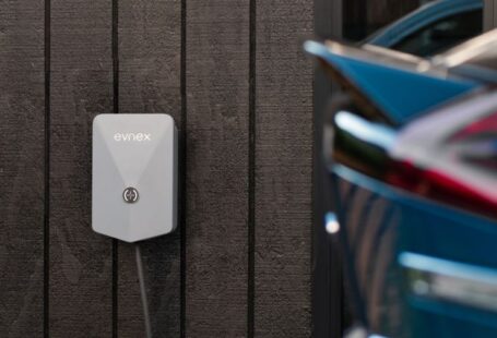 EV Solar - a car plugged in to a wall charger