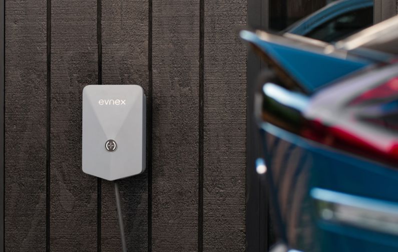 EV Solar - a car plugged in to a wall charger