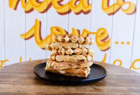 Micro Solar - a stack of waffles sitting on top of a black plate