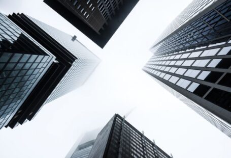 Economics Solar - low angle photography of high rise buildings